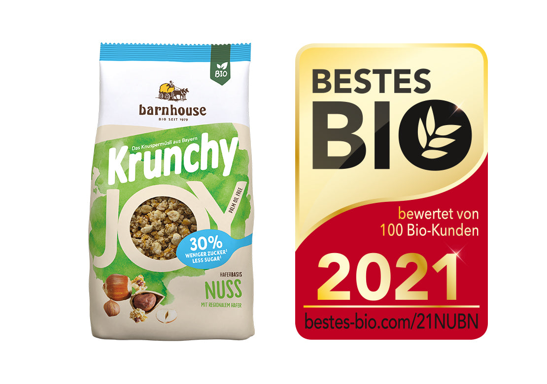 Packshot von Krunchy Joy Nuss, daneben das Siegel für "Bestes Bio 2021".