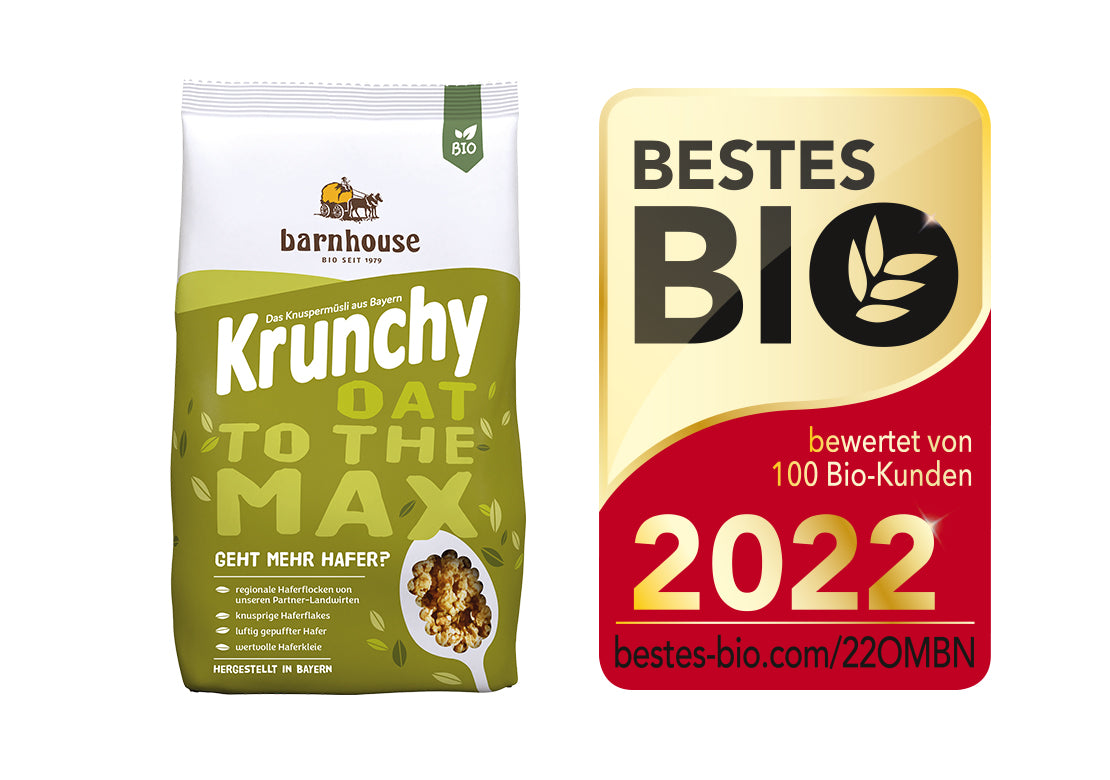 Packshot von Krunchy Oat to the Max, daneben das Siegel für "Bestes Bio 2022".