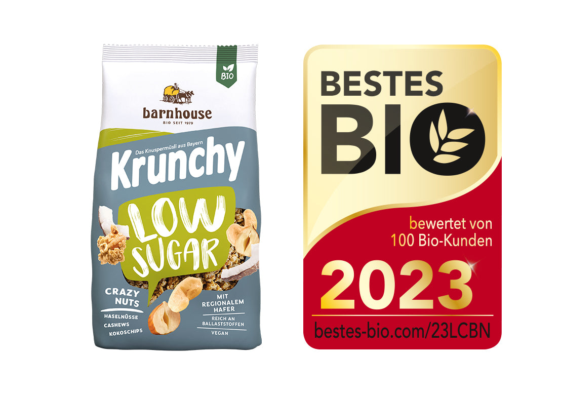 Packshot von Krunchy Low Sugar Crazy Nuts, daneben das Siegel für "Bestes Bio 2023".