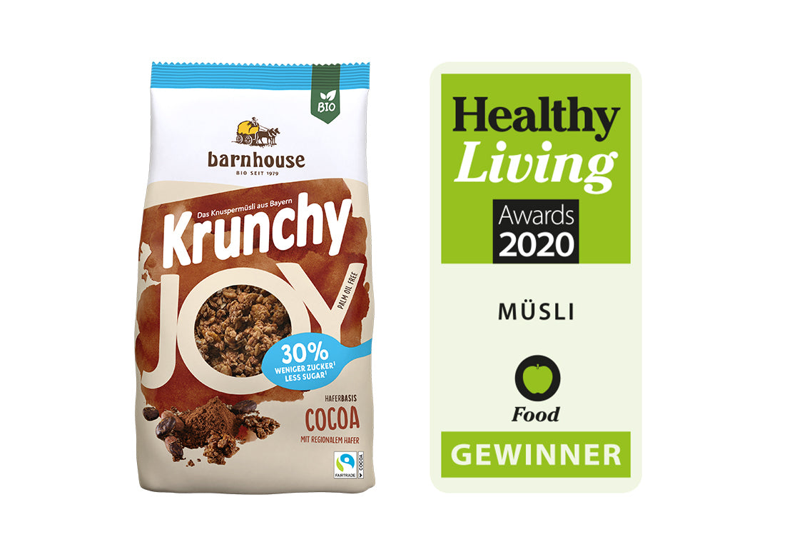 Packshot von Krunchy Joy Cocoa, daneben das Sieger-Label für "Healthy Living Award 2020" im Bereich Müsli.