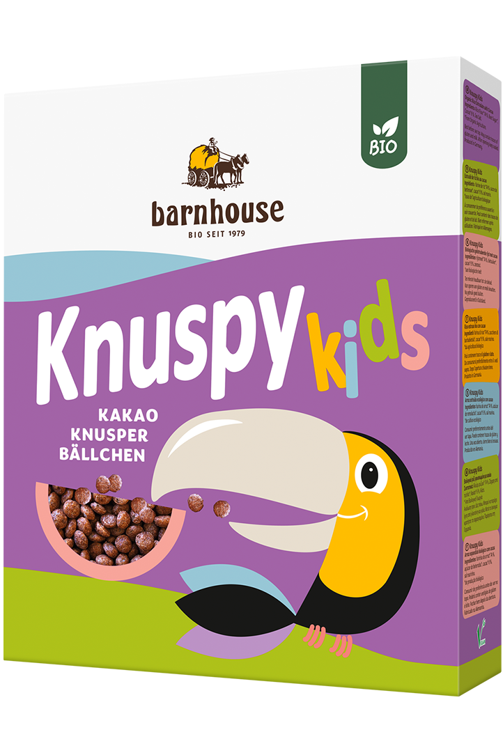 Violetter Karton Knuspy Kids des Bio-Knuspermüsli-Herstellers Barnhouse mit einem farbigen Tukan auf der Packung, der Knusopy Kids isst,