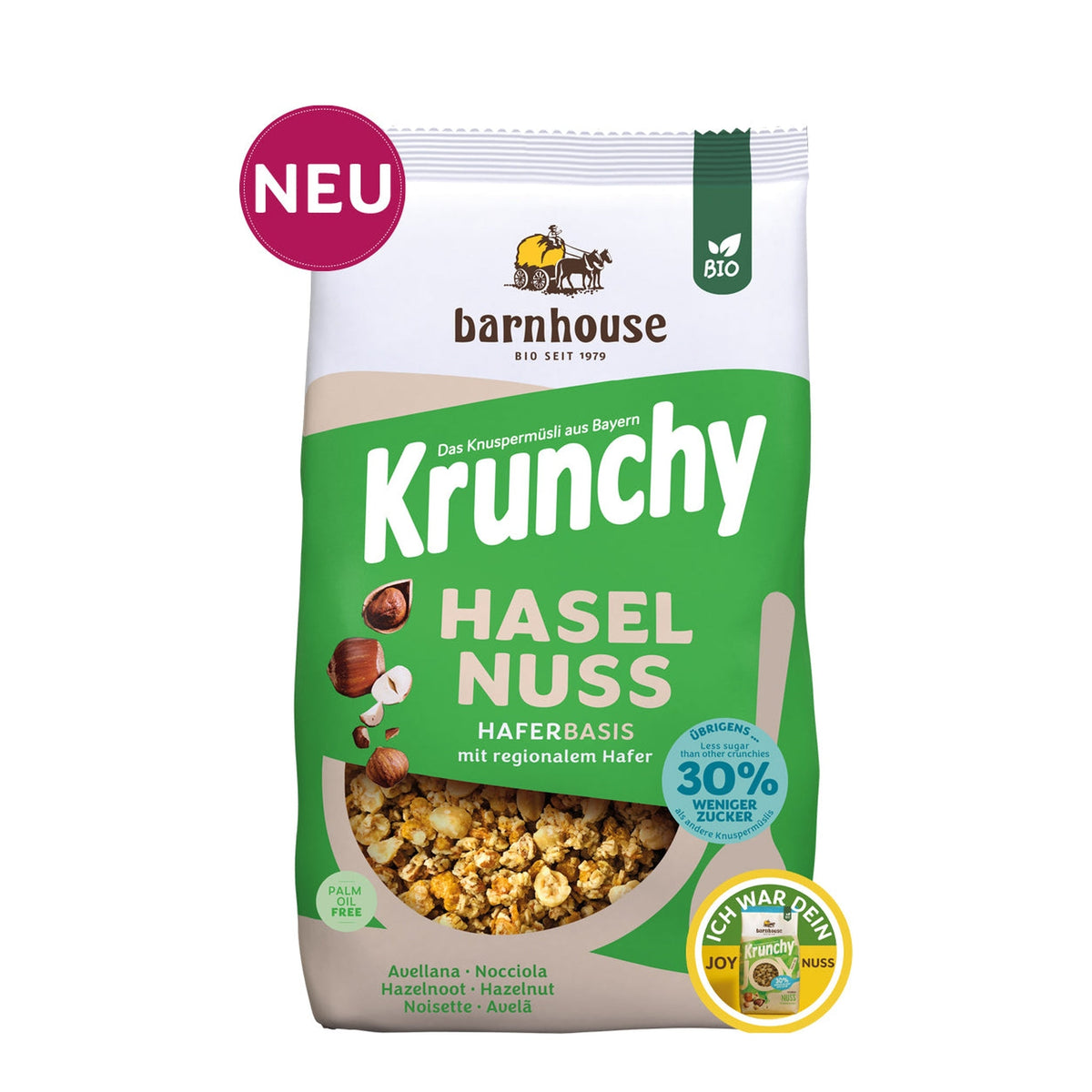 Packshot vom grünen-beigen Beutel Krunchy Haselnuss weniger Zucker von Bio-Knuspermüsli-Hersteller Barnhouse mit "Neu"und "Ich war dein Joy Nuss" Button