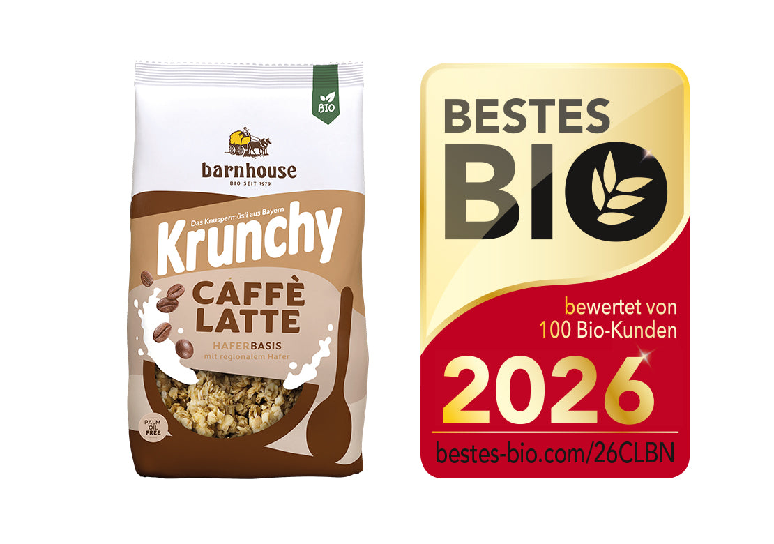 Packshot von Krunchy Caffè Latte, daneben das Siegel für "Bestes Bio 2026".