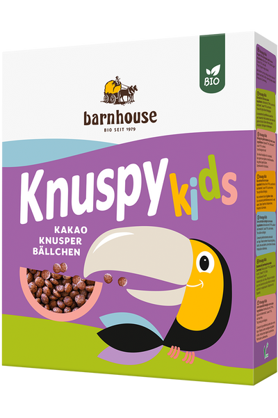 Violetter Karton Knuspy Kids des Bio-Knuspermüsli-Herstellers Barnhouse mit einem farbigen Tukan auf der Packung, der Knusopy Kids isst,