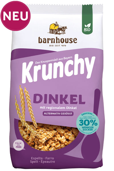 Packshot vom lila Beutel Krunchy Dinkel weniger Zucker von Bio-Knuspermüsli-Hersteller Barnhouse mit Neu-Button