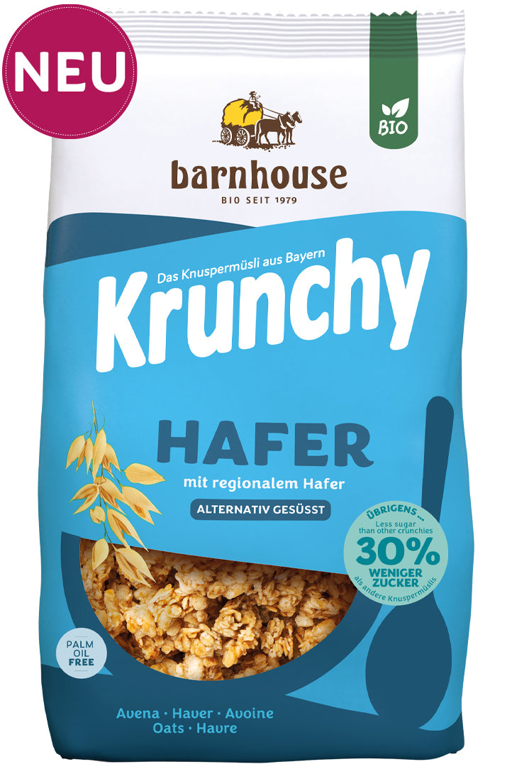 Packshot vom blauen Beutel Krunchy Hafer weniger Zucker von Bio-Knuspermüsli-Hersteller Barnhouse mit Neu-Button