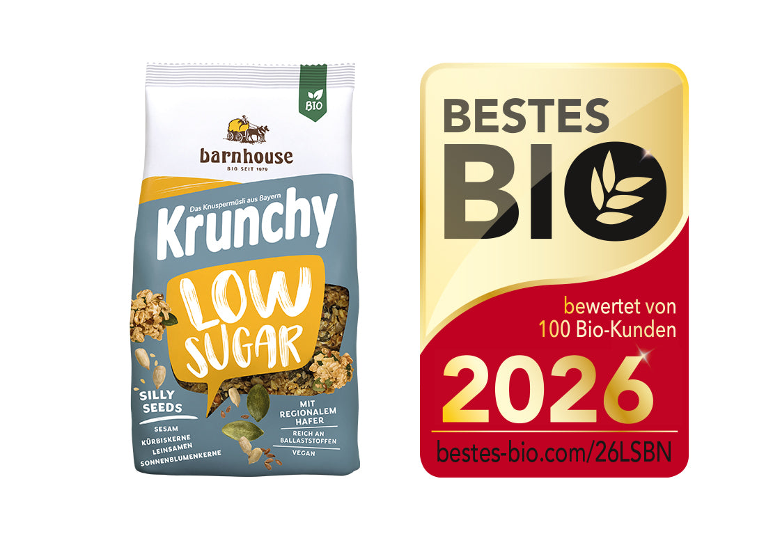 Packshot von Krunchy Low Sugar Silly Seeds, daneben das Siegel für "Bestes Bio 2026".